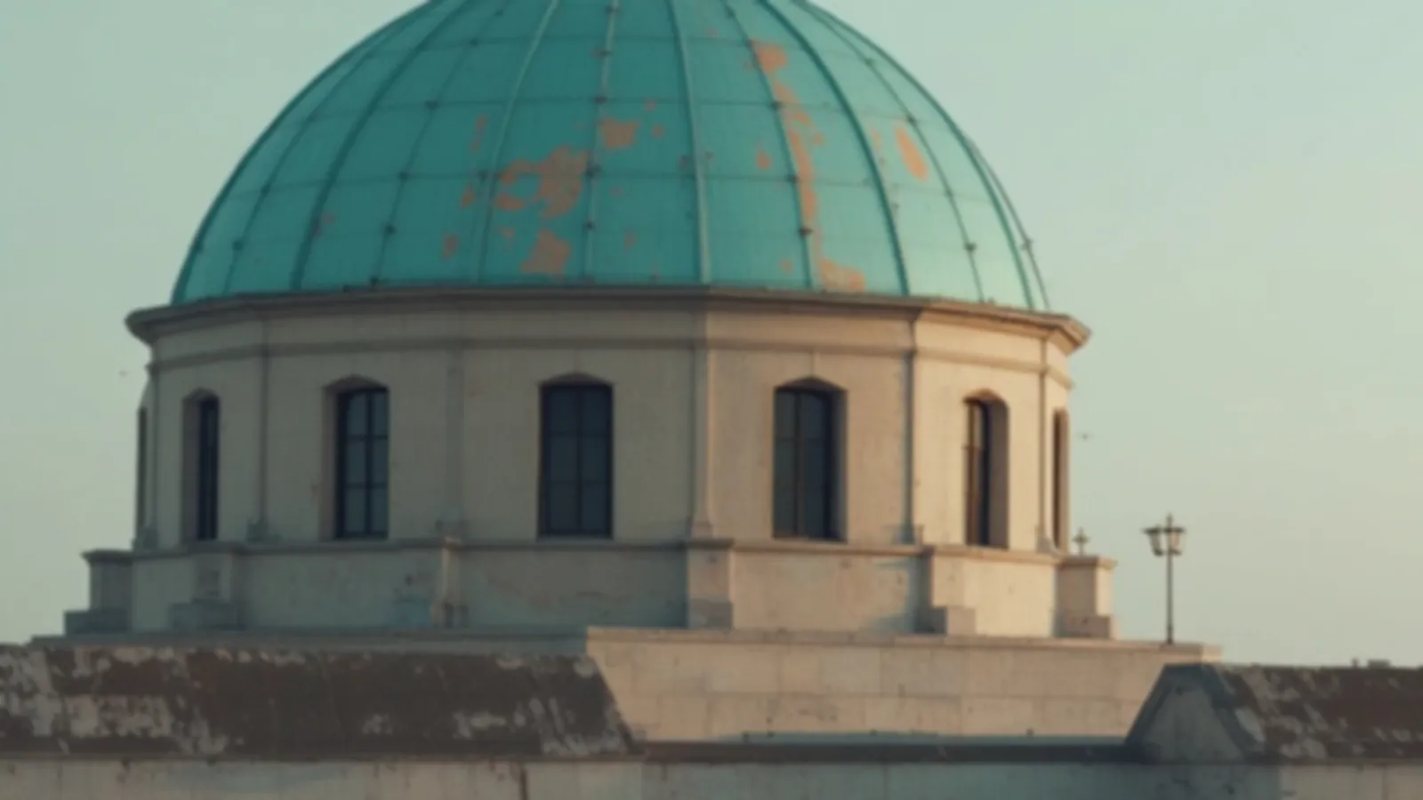 A weathered teal copper dome against a pale morning sky, the FundsCopper view of payday loans online, $100 – $5,000